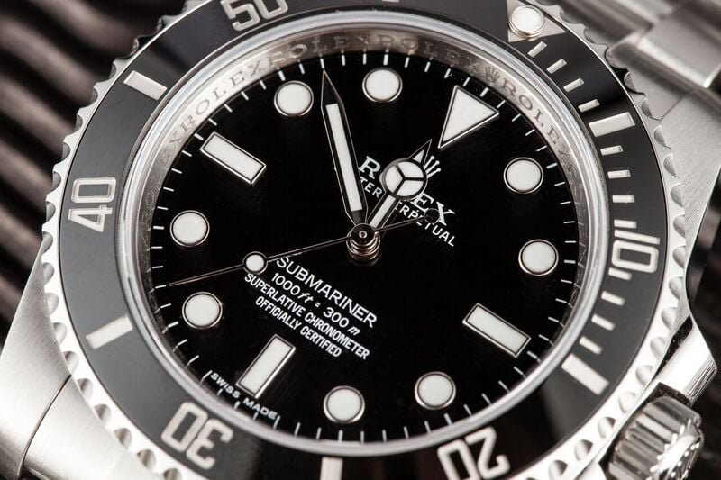 A Submariner 114060 is a stainless steel watch.